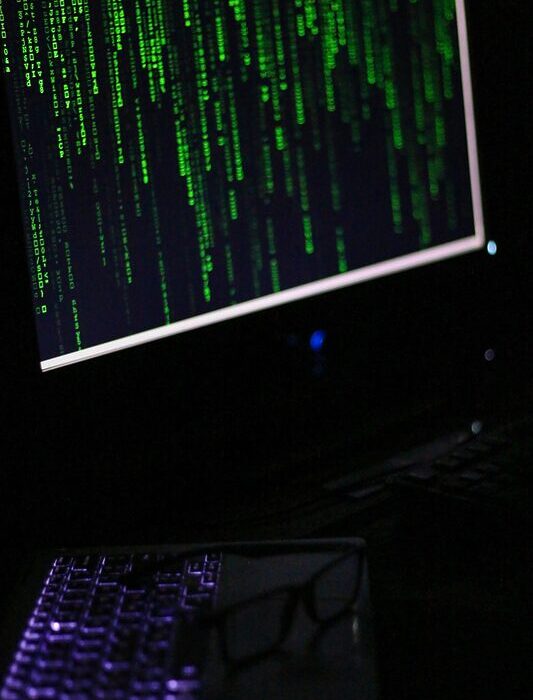 A computer monitor sitting on top of a desk