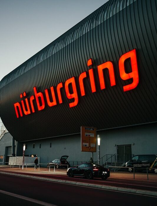a large building with a neon sign on the side of it
