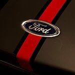 A ford logo with a red racing stripe.