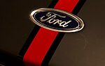 A ford logo with a red racing stripe.