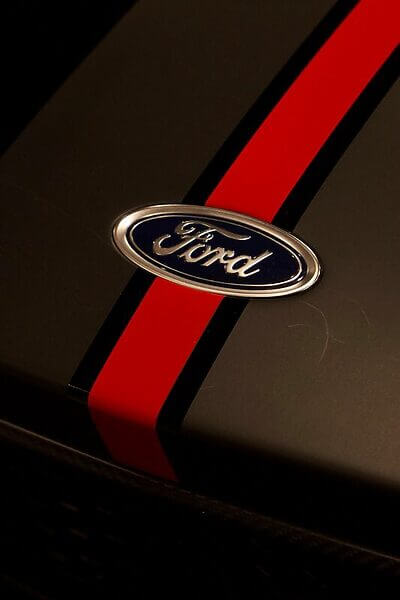 A ford logo with a red racing stripe.