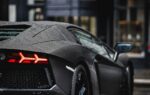 black porsche 911 parked on street during daytime