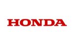 Usine Honda avec des véhicules en cours d’assemblage sur une ligne de production.