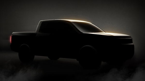 Des véhicules Honda sur un site de production automobile.