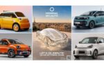 Une allée du Mondial de l'Auto à Paris, entourée de stands de constructeurs et de nouveaux modèles.